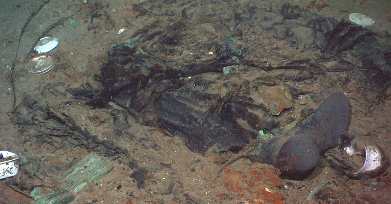 A boot partially buried under the mud at the titanic wreck site.